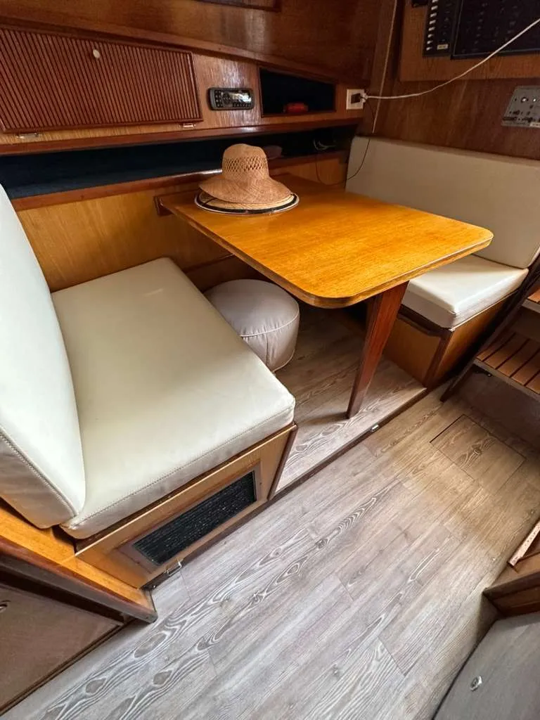 Slide: The Image of Interior of 1988 Atlantic 34 Express with wooden table and seating. - 14