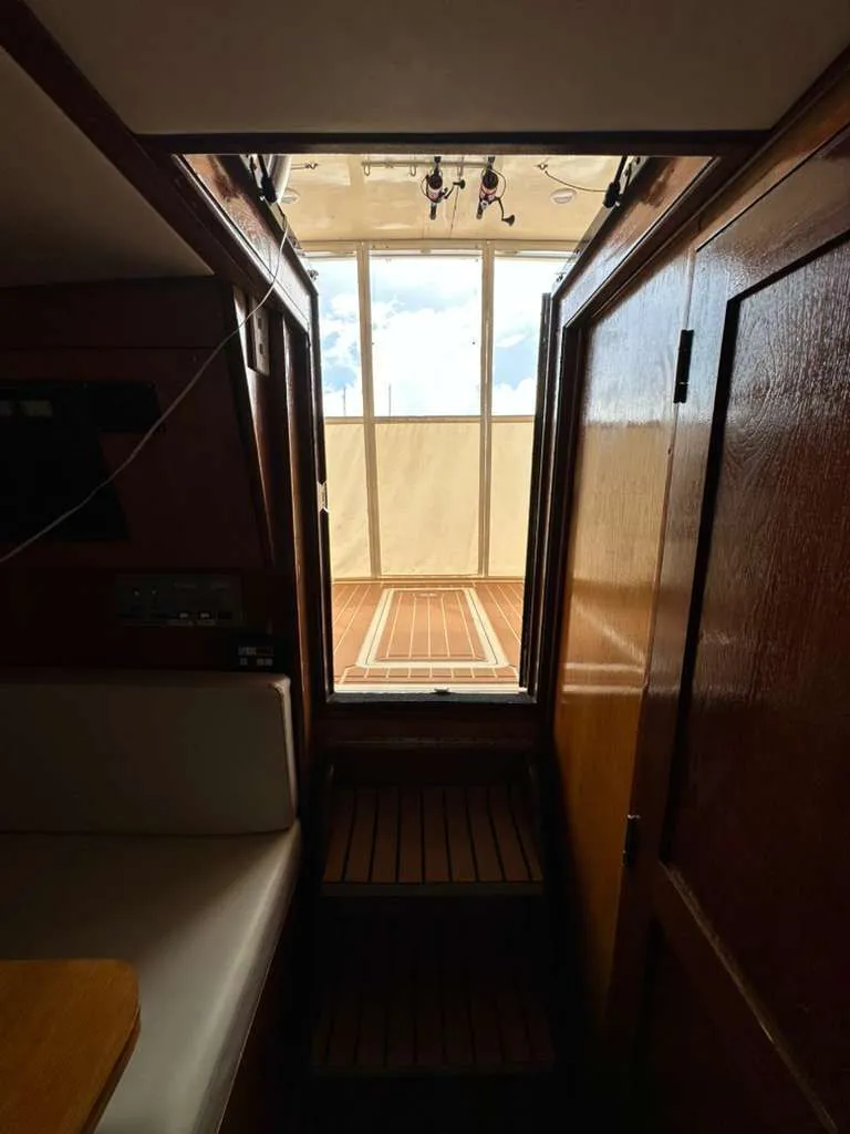 Slide: The Image of Interior of 1988 Atlantic 34 Express yacht with wooden finish. - 17