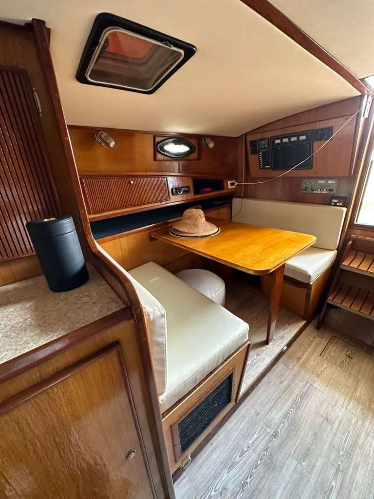 Slide: The Image of 1988 Atlantic 34 Express yacht interior with wooden furnishings. - 19