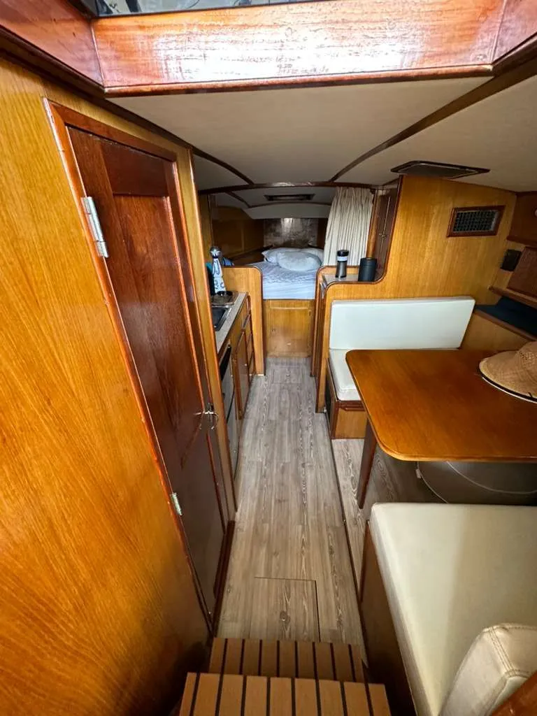 Slide: The Image of Interior of a 1988 Atlantic 34 Express yacht with wooden furnishings. - 22