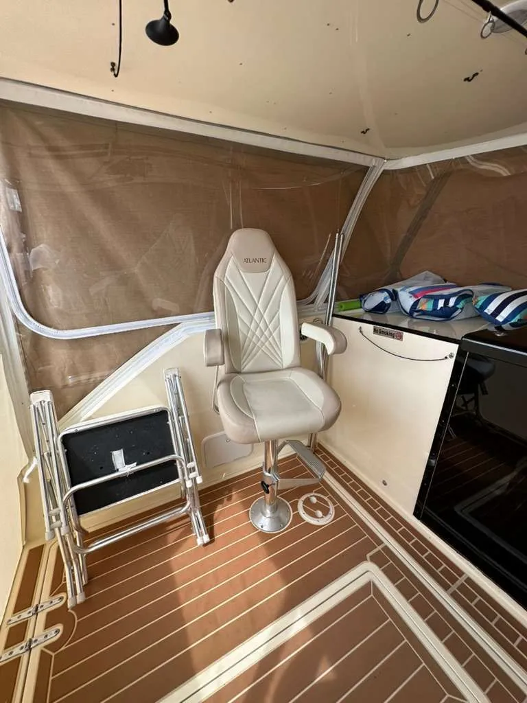 Slide: The Image of Interior of a 1988 Atlantic 34 Express boat with seat and ladder. - 24