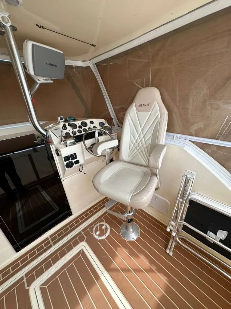 Slide: The Image of Interior of a 1988 Atlantic 34 Express boat with helm station. - 26