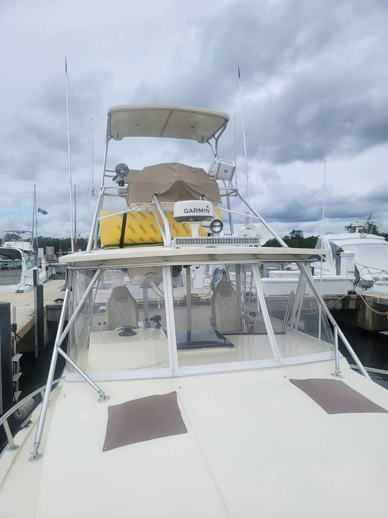 Slide: The Image of 1988 Atlantic 34 Express boat docked with Garmin equipment. - 3