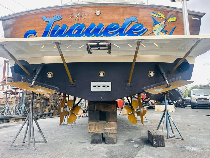 Slide: The Image of Rear view of a 1988 Atlantic 34 Express boat on blocks. - 33