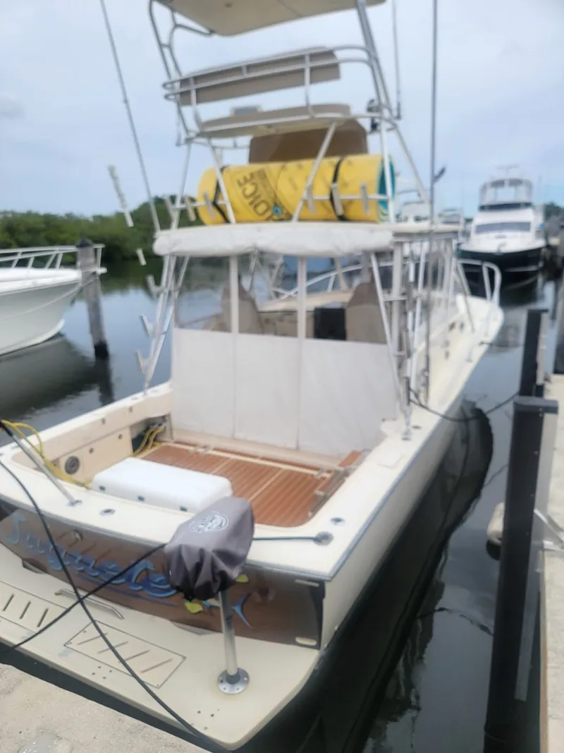 Slide: The Image of 1988 Atlantic 34 Express boat docked at marina. - 5