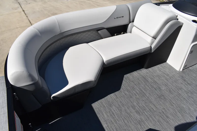 Slide: The Image of 2026 Lowe SS 230 WT boat interior with sleek, modern seating and gray flooring. - 12