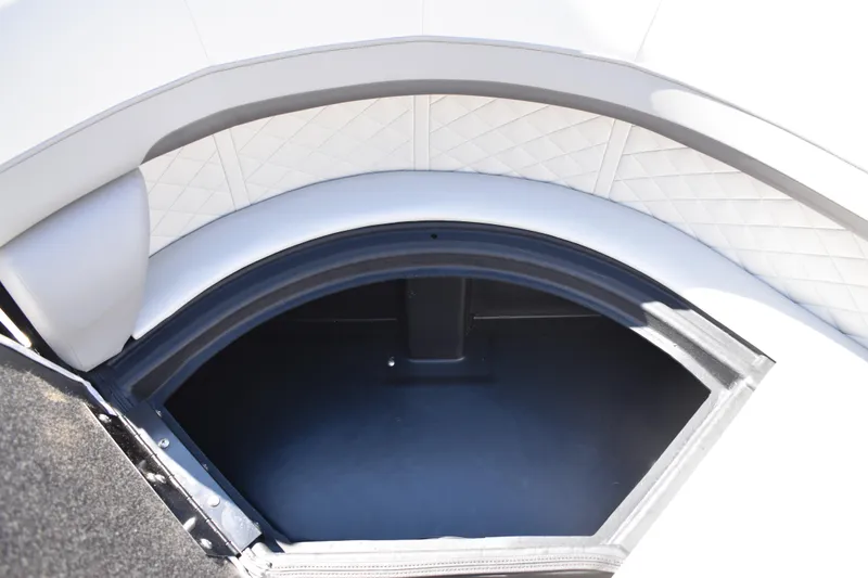 Slide: The Image of Interior storage compartment of 2026 Lowe SS 230 WT boat, featuring quilted upholstery. - 18