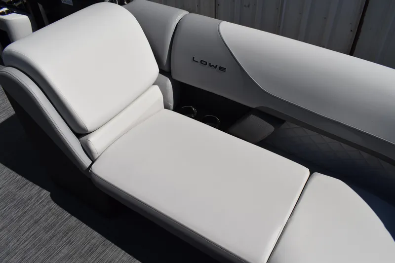 Slide: The Image of 2026 Lowe SS 230 WT boat interior with luxurious white seating. - 19