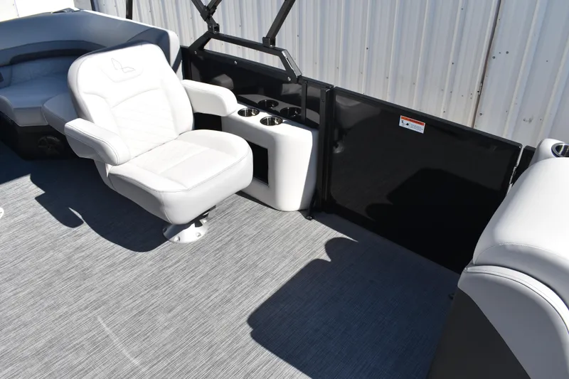 Slide: The Image of 2026 Lowe SS 230 WT boat interior with white seating and cup holders. - 24