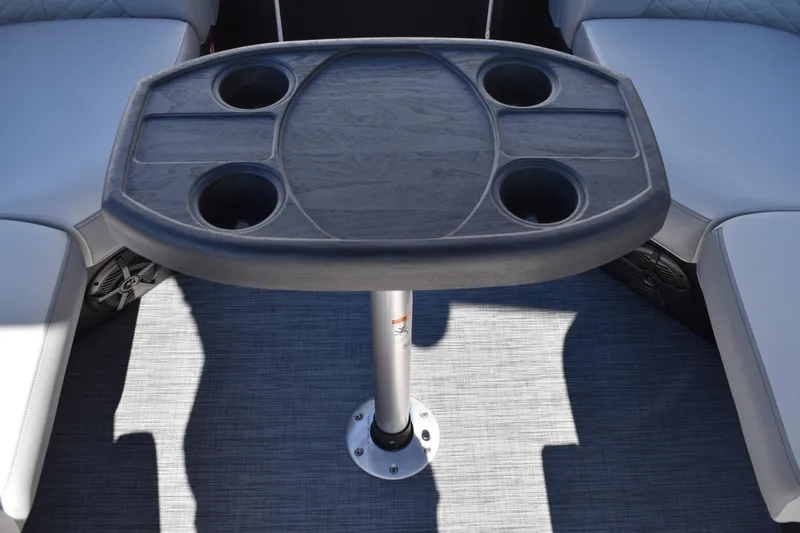 Slide: The Image of Lowe SS 230 WT 2026 boat interior with table and cup holders. - 38
