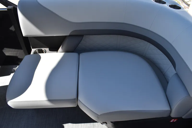Slide: The Image of Luxurious seating on 2026 Lowe SS 230 WT boat with quilted upholstery and cup holders. - 39