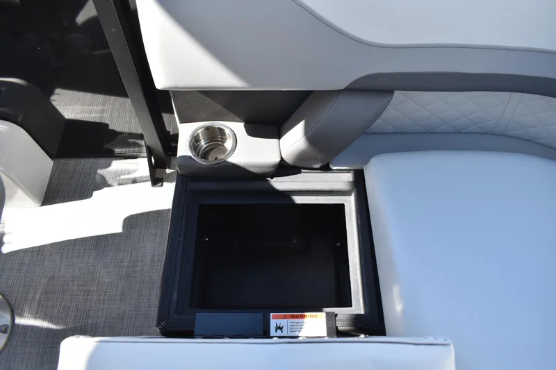 Slide: The Image of Interior of 2026 Lowe SS 230 WT boat with storage compartment and cup holder. - 40