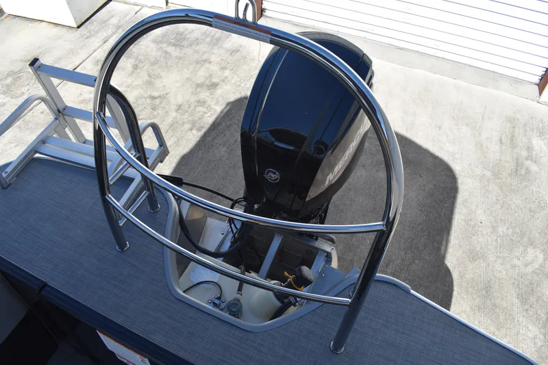 Slide: The Image of 2026 Lowe SS 230 WT boat with outboard motor and safety railing. - 45