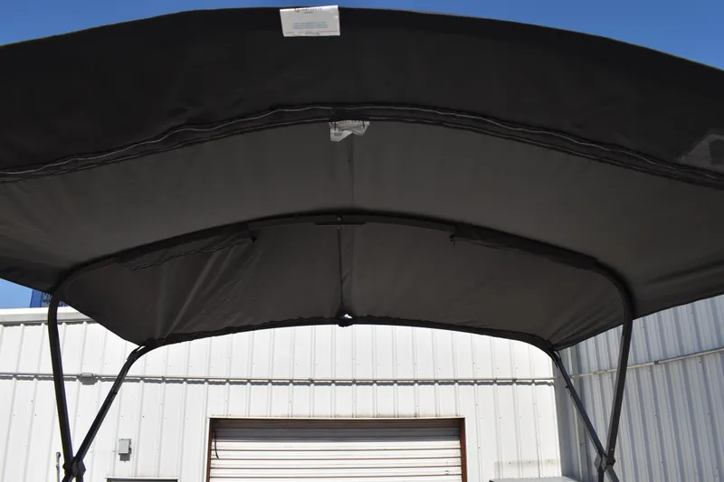 Slide: The Image of 2026 Lowe SS 230 WT boat canopy against a clear blue sky. - 48