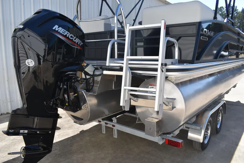 Slide: The Image of 2026 Lowe SS 230 WT pontoon boat with Mercury outboard motor, on a trailer. - 5