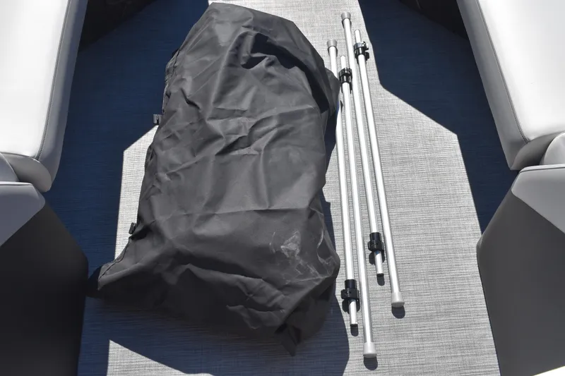 Slide: The Image of Black bag and metal poles on Lowe SS 230 WT boat floor, 2026 model. - 50