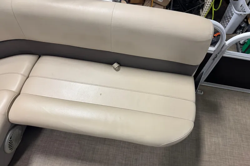 Slide: The Image of 2022 Sun Tracker Bass Buggy 18 DLX beige boat seating with speaker detail. - 13