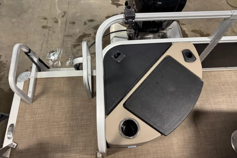 Slide: The Image of 2022 Sun Tracker Bass Buggy 18 DLX boat deck with ladder and motor. - 17