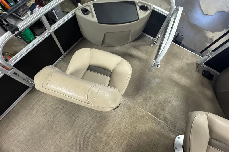 Slide: The Image of 2022 Sun Tracker Bass Buggy 18 DLX interior with beige seating and flooring. - 7