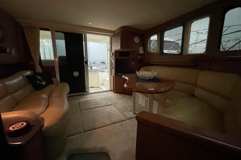 Slide: The Image of Interior of 2005 Silverton 34 Convertible yacht with plush seating and elegant decor. - 26