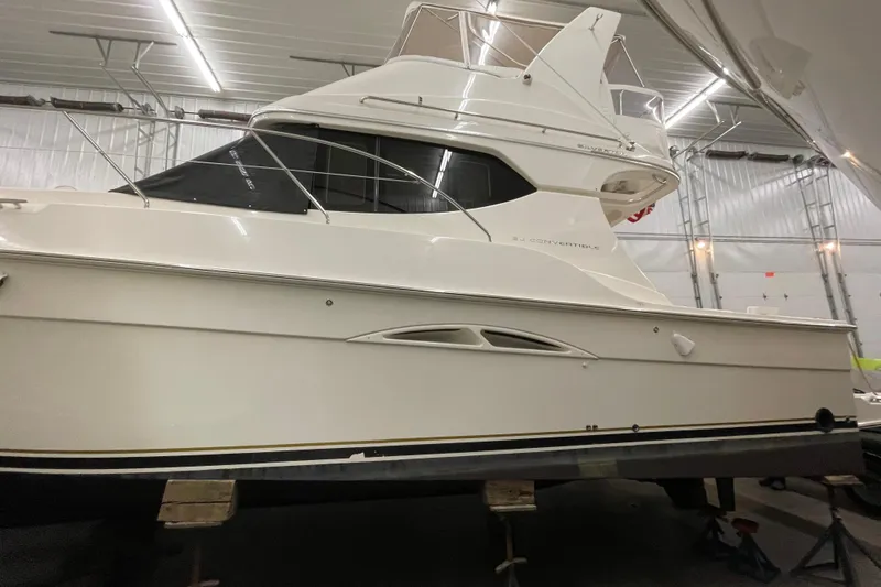 Slide: The Image of 2005 Silverton 34 Convertible yacht in indoor storage, side view. - 3