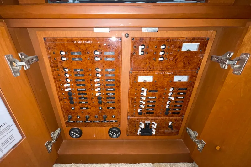 Slide: The Image of Electrical panel of a 2005 Silverton 34 Convertible boat, featuring 12 VDC and 120 VAC power controls. - 30