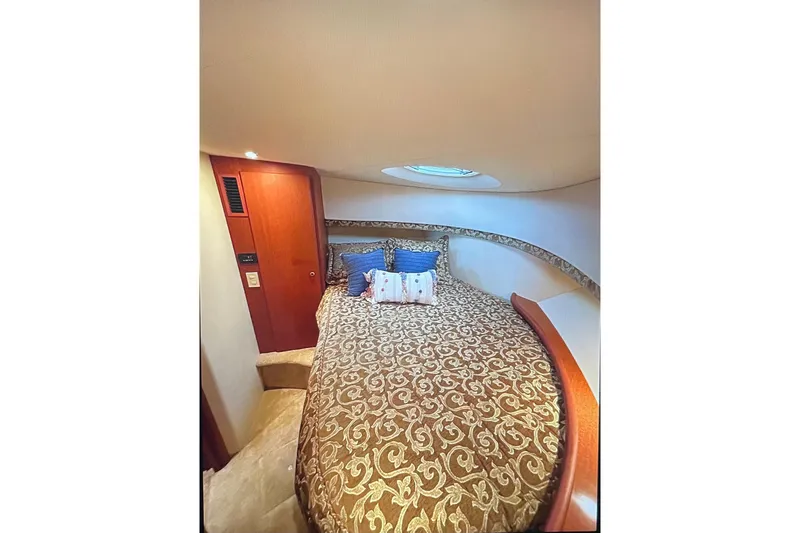 Slide: The Image of Luxurious cabin interior of 2005 Silverton 34 Convertible yacht with elegant bedding. - 35