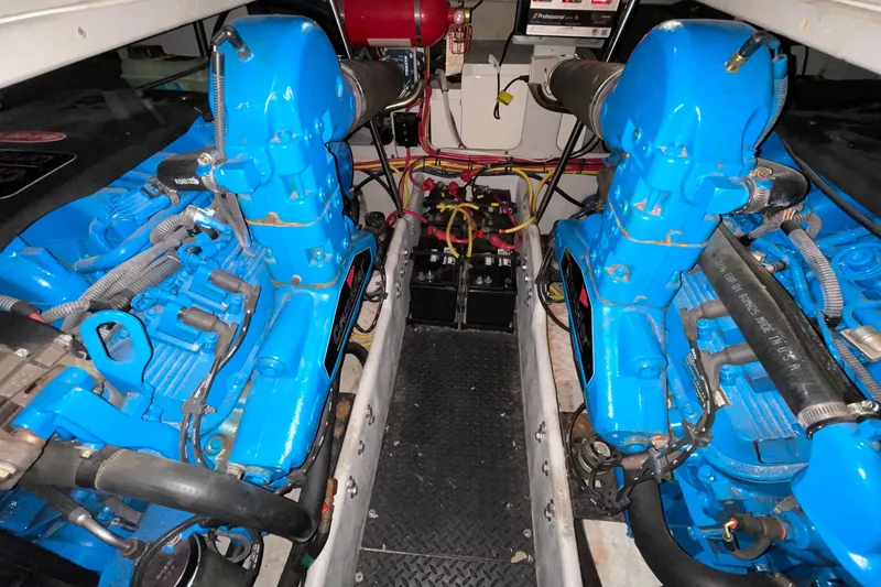 Slide: The Image of Engine room of a 2005 Silverton 34 Convertible with blue engines and wiring. - 42