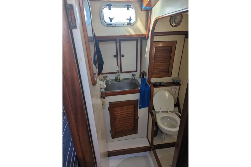 Slide: The Image of Interior of 1990 Bruce Roberts Mauritius Ketch bathroom with sink and toilet. - 17
