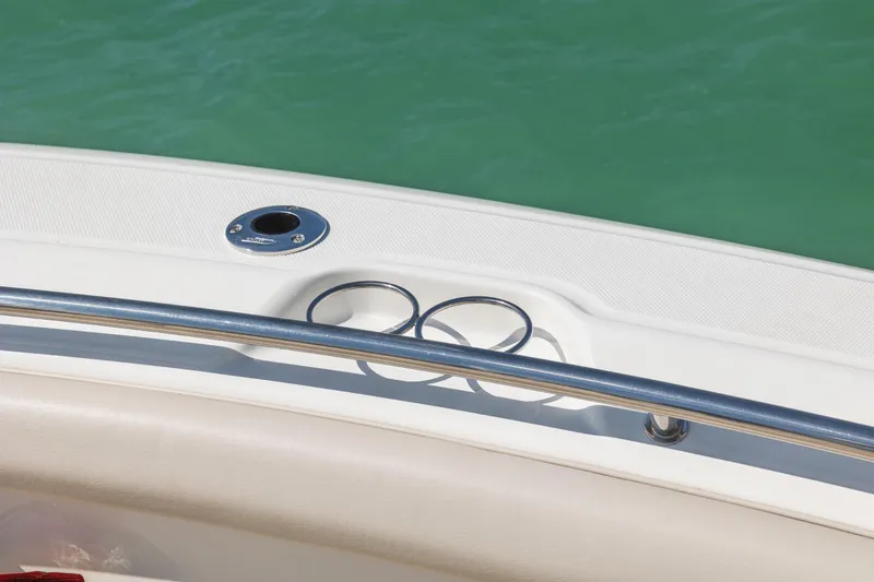 Slide: The Image of 2017 Boston Whaler 350 Outrage boat detail with cup holders and railing. - 16