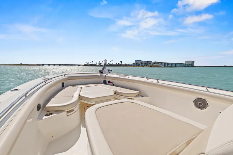Slide: The Image of 2017 Boston Whaler 350 Outrage boat on calm waters under blue sky. - 18