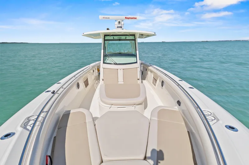Slide: The Image of 2017 Boston Whaler 350 Outrage boat on calm ocean waters under blue sky. - 19