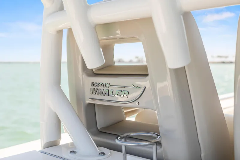 Slide: The Image of 2017 Boston Whaler 350 Outrage boat detail with logo, ocean background. - 20