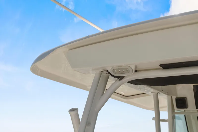 Slide: The Image of 2017 Boston Whaler 350 Outrage boat canopy against blue sky. - 21
