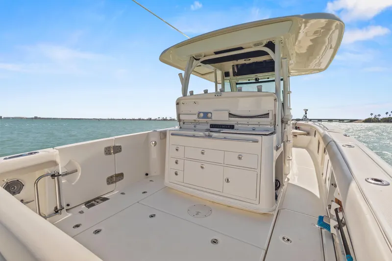 Slide: The Image of 2017 Boston Whaler 350 Outrage boat interior with ocean view and clear sky. - 25