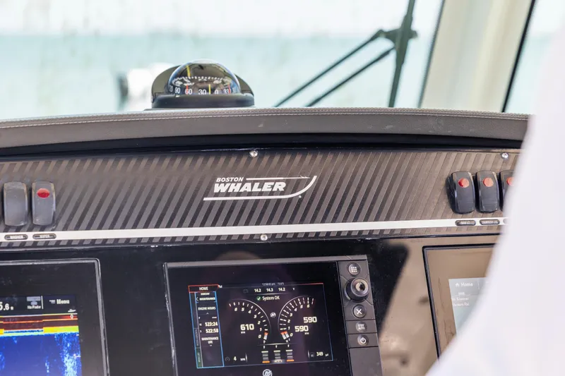 Slide: The Image of Dashboard of a 2017 Boston Whaler 350 Outrage boat with navigation instruments. - 34