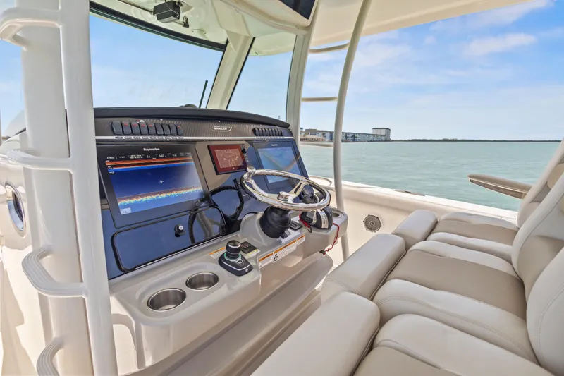 Slide: The Image of 2017 Boston Whaler 350 Outrage helm with advanced navigation displays and comfortable seating. - 35