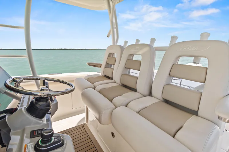 Slide: The Image of 2017 Boston Whaler 350 Outrage helm seating with ocean view. - 38