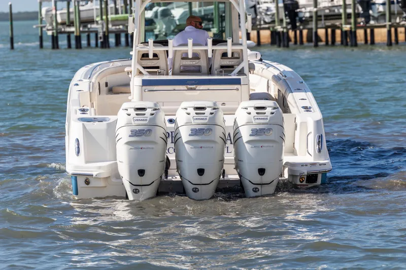 Slide: The Image of 2017 Boston Whaler 350 Outrage with triple Mercury Verado engines on water. - 46