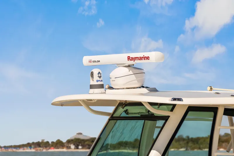 Slide: The Image of 2017 Boston Whaler 350 Outrage with Raymarine radar, clear sky background. - 47