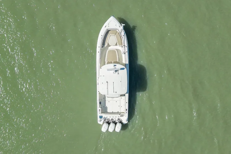 Slide: The Image of Aerial view of 2017 Boston Whaler 350 Outrage on green water. - 5
