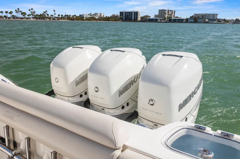Slide: The Image of 2017 Boston Whaler 350 Outrage with triple Mercury outboard engines on water. - 8