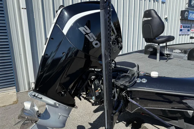 Slide: The Image of 2020 Blazer 625 Pro Elite boat with powerful 250 HP engine, parked outdoors. - 10