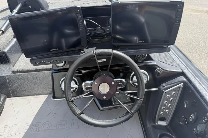 Slide: The Image of Dashboard of 2020 Blazer 625 Pro Elite with dual Garmin displays and steering wheel. - 13