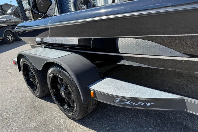 Slide: The Image of 2020 Blazer 625 Pro Elite boat trailer with black wheels and diamond plate accents. - 3