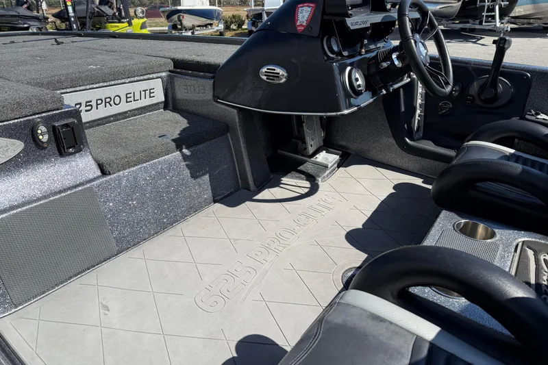 Slide: The Image of 2020 Blazer 625 Pro Elite boat interior with steering console and seating area. - 6