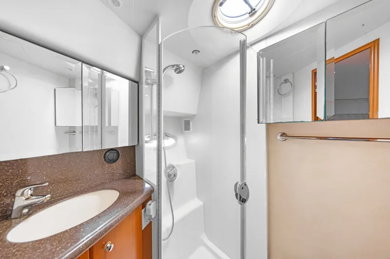 Slide: The Image of Bathroom in 2007 Silverton 45 Convertible with shower and sink. - 21
