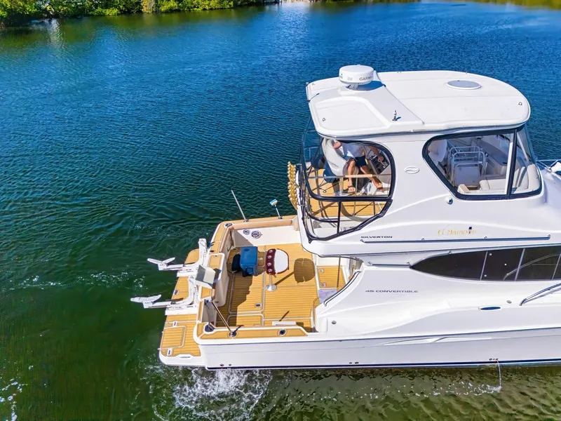 Slide: The Image of 2007 Silverton 45 Convertible Yacht on calm water. - 4