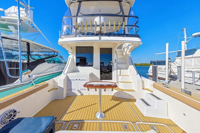 Slide: The Image of 2007 Silverton 45 Convertible Yacht at dock, sunny day. - 7