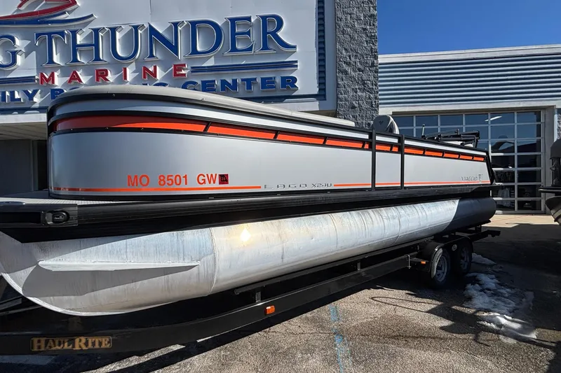The Image of 2026 Viaggio X24U pontoon boat on trailer at marine center. - 1